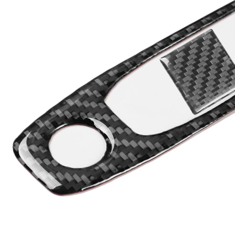 Black carbon-fiber reading light panel cover with two circular cutouts and center square