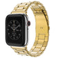 Gold stainless steel link watch band with fold-over buckle, shown on a smartwatch
