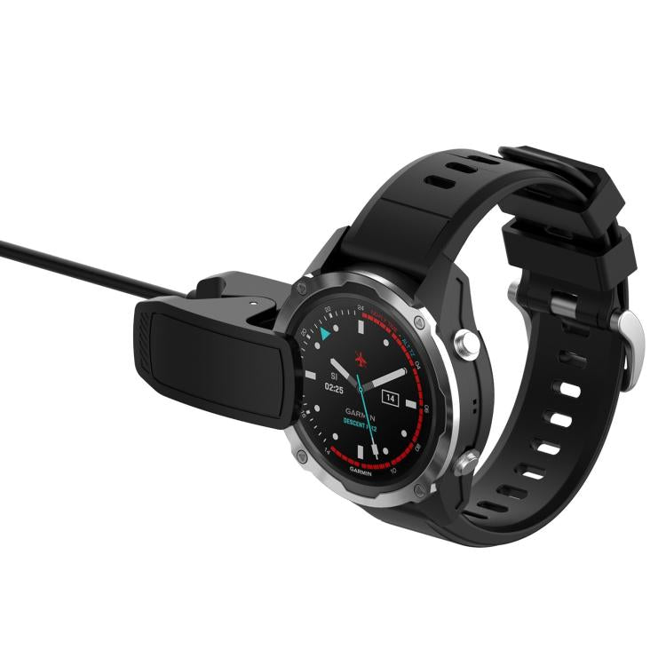 Black clip charger attached to a Garmin MARQ ATHLETE Gen1 watch