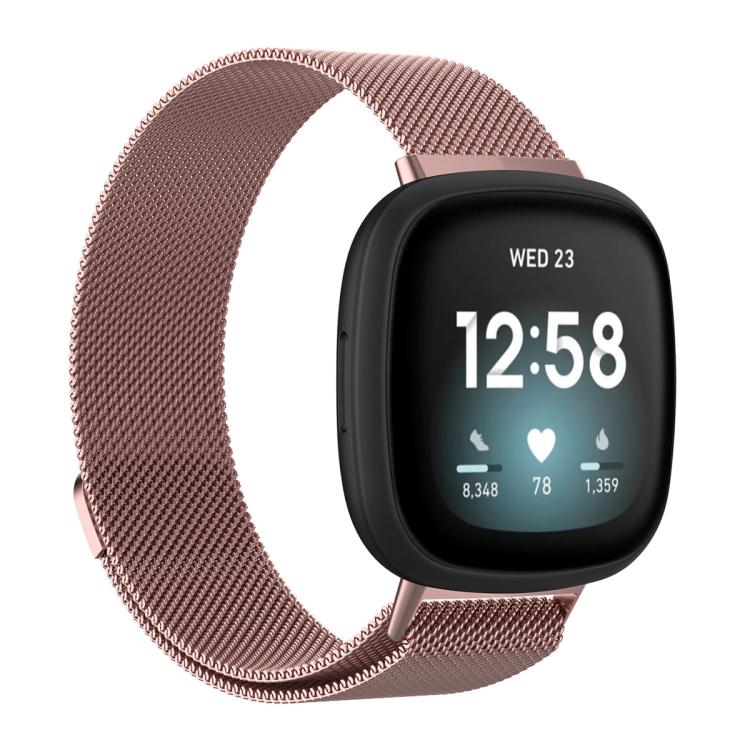 Rose pink Milanese metal watch band attached to a smartwatch