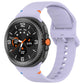 Light lavender silicone watch band with adjustable holes and buckle on a black smartwatch.