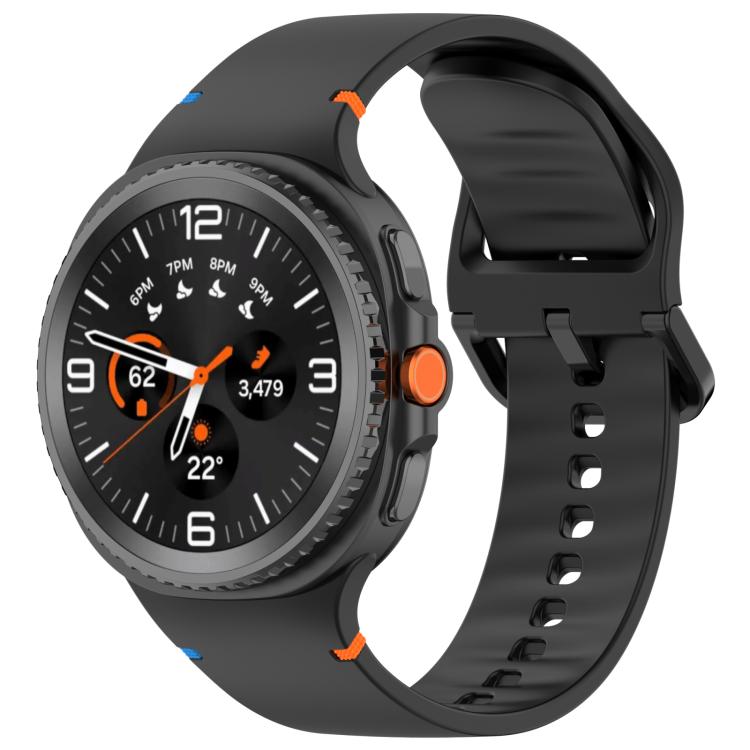 Black silicone watch band with adjustable holes and buckle, fitted to a black smartwatch.