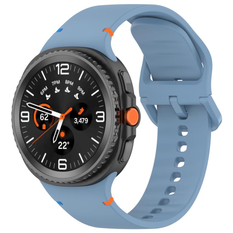 Blue silicone smartwatch band with a perforated strap and matching buckle.