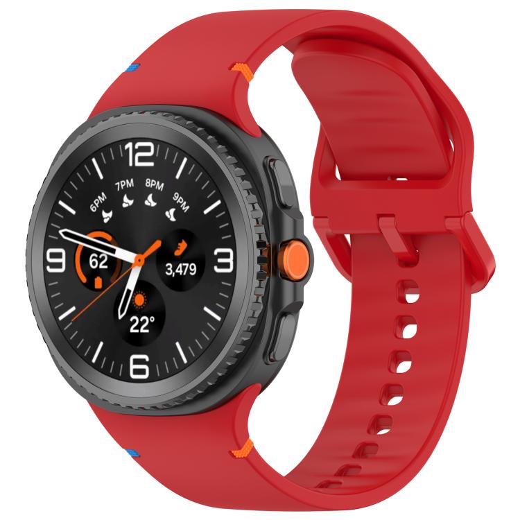 Red silicone watch band with buckle and adjustment holes, shown fitted to a smartwatch.