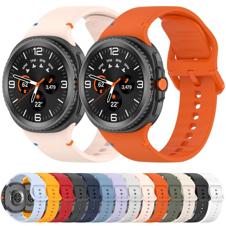 Light pink and orange silicone watch bands on watches, with a row of available band colors below.