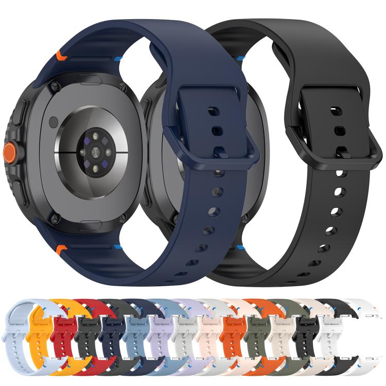 Navy and black silicone watch bands fitted to smartwatches, showing the back and adjustable buckles.