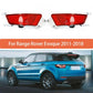 Pair of rear bumper fog lights with red lenses, each with black bulb housing