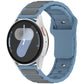 Blue gray silicone watch band with dark gray inlay panels, shown on a smartwatch.