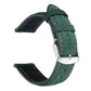 Green leather watch band with contrast stitching, adjustment holes, and a silver buckle.