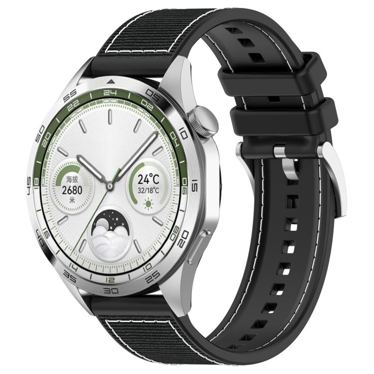 Black hybrid nylon and silicone watch band with stitched panels and adjustable holes, shown on a watch.