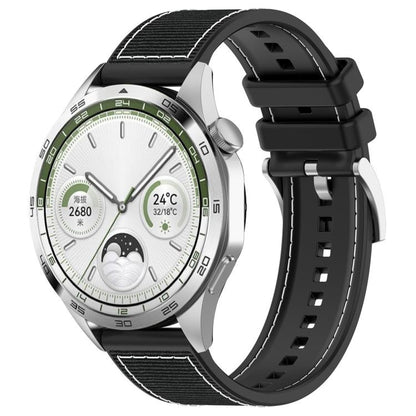 Black hybrid nylon and silicone watch band with stitched panels and adjustable holes, shown on a watch.