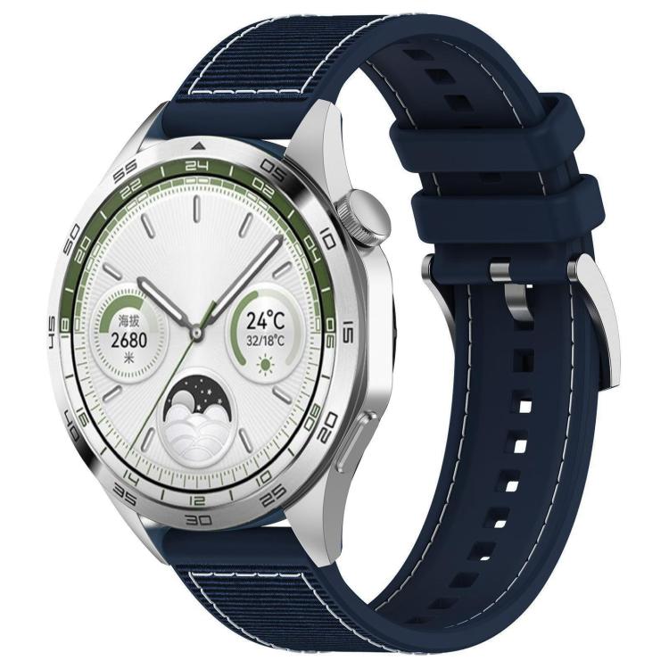Midnight blue hybrid nylon and silicone watch band with stitched panels and adjustable holes, shown on a watch.