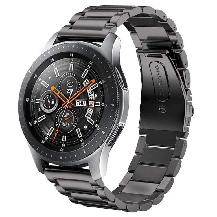 Black three-link watch band with flat clasp, shown attached to a watch.