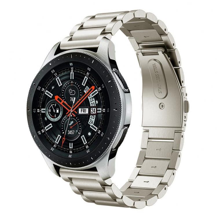 Titanium-color three-link watch band with folding clasp, shown attached to a watch.
