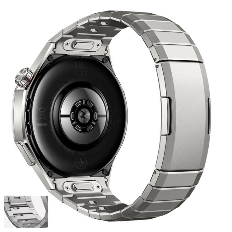 Silver titanium alloy watch band on a smartwatch, with segmented links and quick-release connectors.