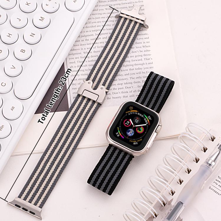Black and gray striped nylon watch bands, one shown with a watch and one laid flat
