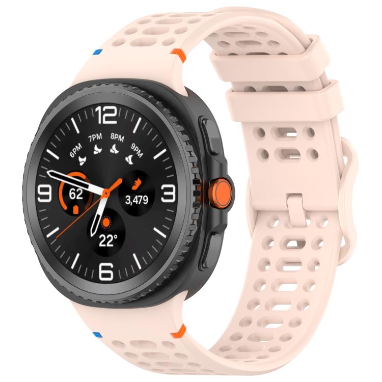 Pale pink perforated silicone watch band with a dark Galaxy smartwatch attached