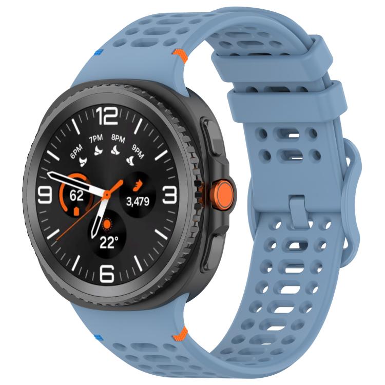 Blue perforated silicone watch band with a dark Galaxy smartwatch attached