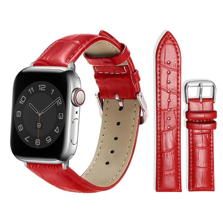 Red leather watch strap with raised texture, adjustment holes, and a silver pin buckle.