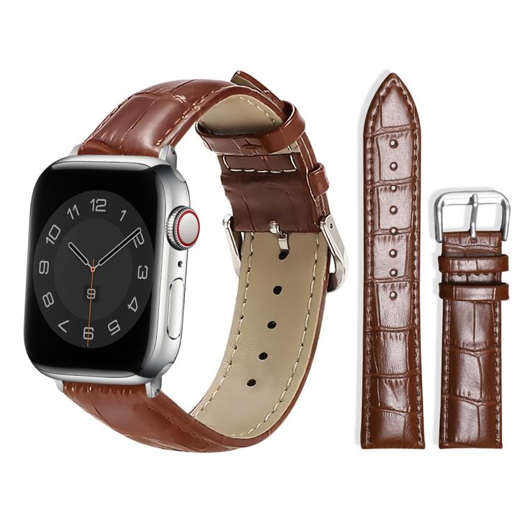 Brown textured leather watch band with silver pin buckle, shown attached to a watch.