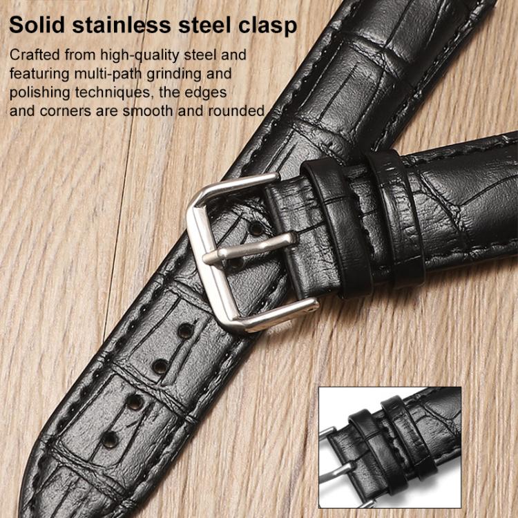 Black textured leather watch band with a close-up of its stainless steel pin buckle.