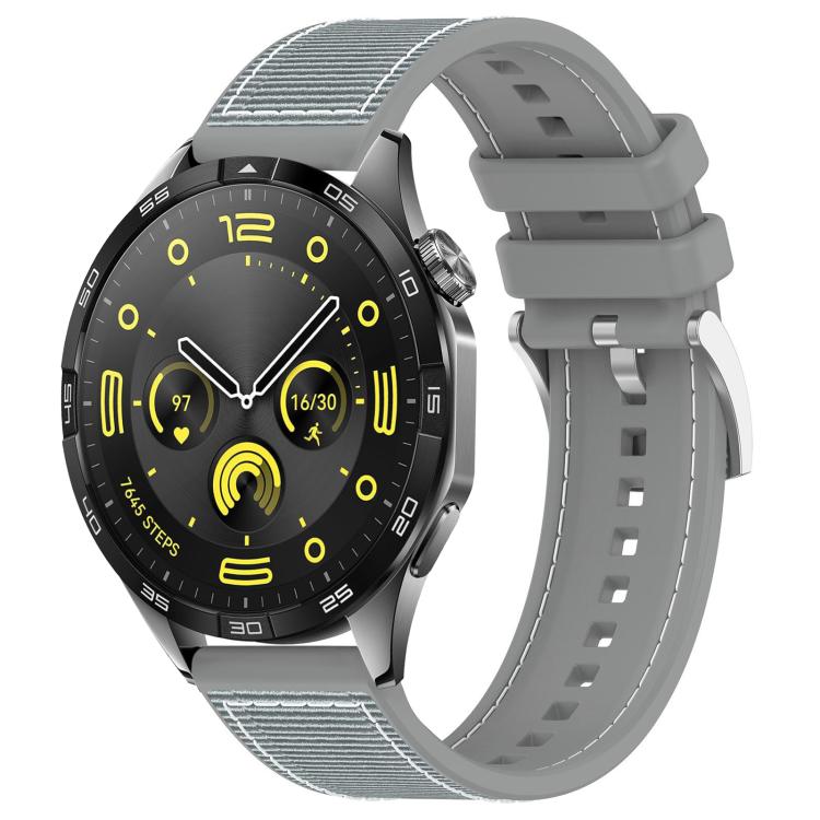 Gray hybrid nylon-braid and silicone watch band attached to a black smartwatch