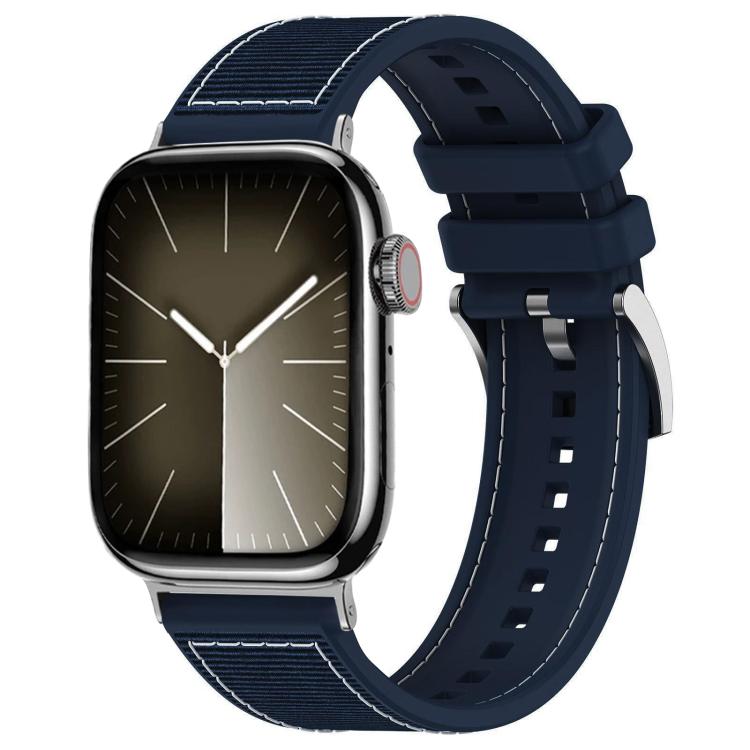 Midnight blue hybrid watch band with woven nylon panels, perforated silicone strap, and metal buckle, on a watch