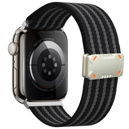 Black and charcoal striped nylon Apple Watch band with a silver magnetic buckle.