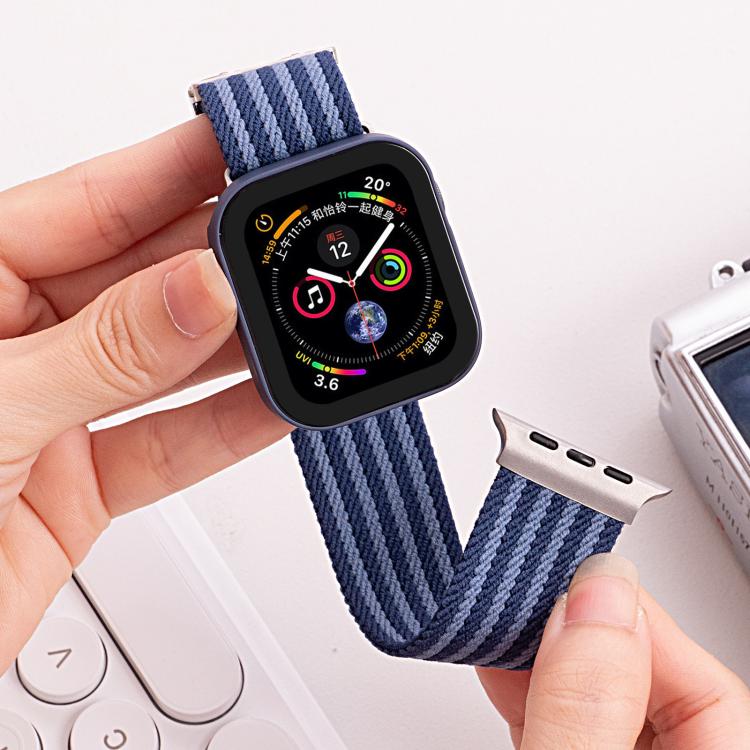Blue striped nylon watch band attached to a smartwatch, shown open