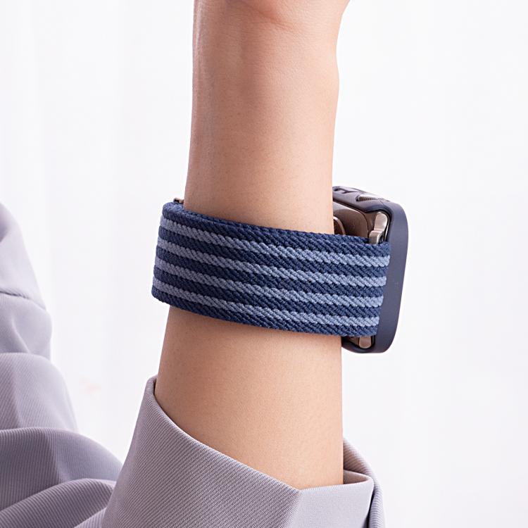 Blue striped nylon watch band worn around the wrist