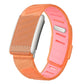 Silicone watch band in translucent orange and pink, with an adjustable perforated strap.
