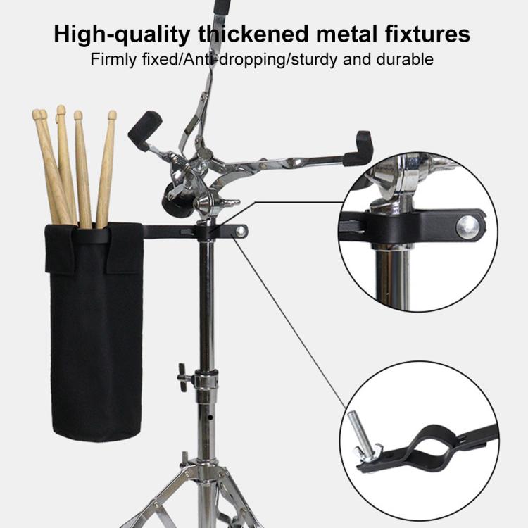 Black drumstick storage bag holding drumsticks with reinforced metal mounting