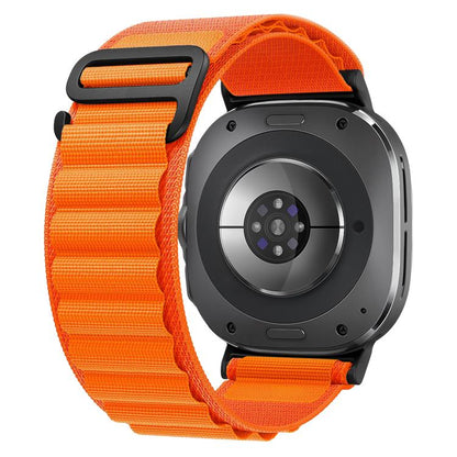 Orange nylon watch band with black buckle loop, shown fitted to a smartwatch