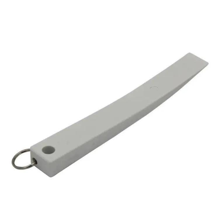 Gray trim removal tool with loop ring and round hole for prying panels