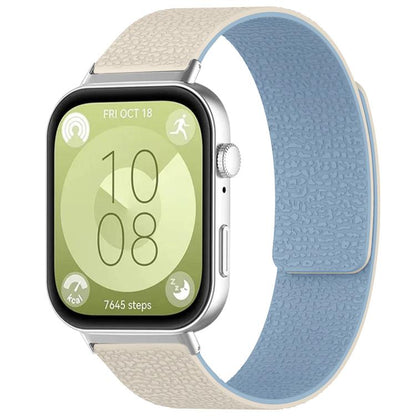 Textured silicone watch band in cream and light blue, shown fitted to a smartwatch.