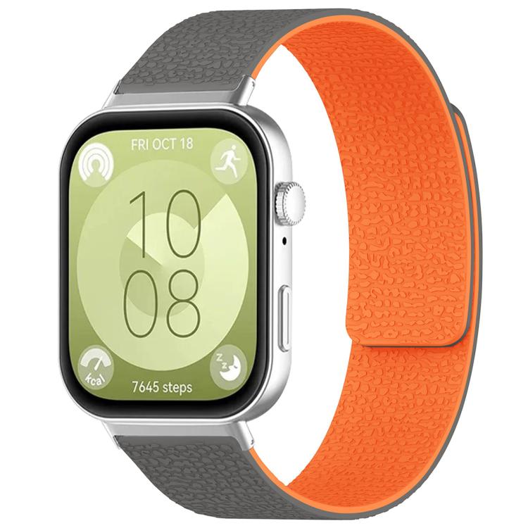 Textured silicone watch band in gray and orange, shown fitted to a smartwatch.