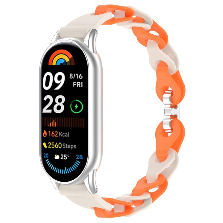 Two-tone orange and off-white hollow-link silicone watch band fitted to a smartwatch.