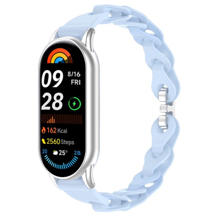 Light blue hollow silicone watch band on a silver Xiaomi Smart Band