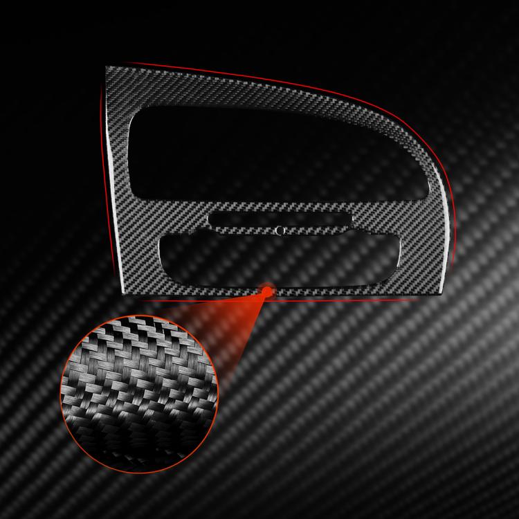 Black carbon-fiber console panel insert with red accent and textured mounting area