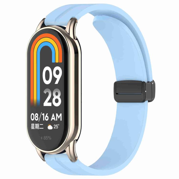 Light blue silicone watch band with folding buckle, shown attached to a smartwatch