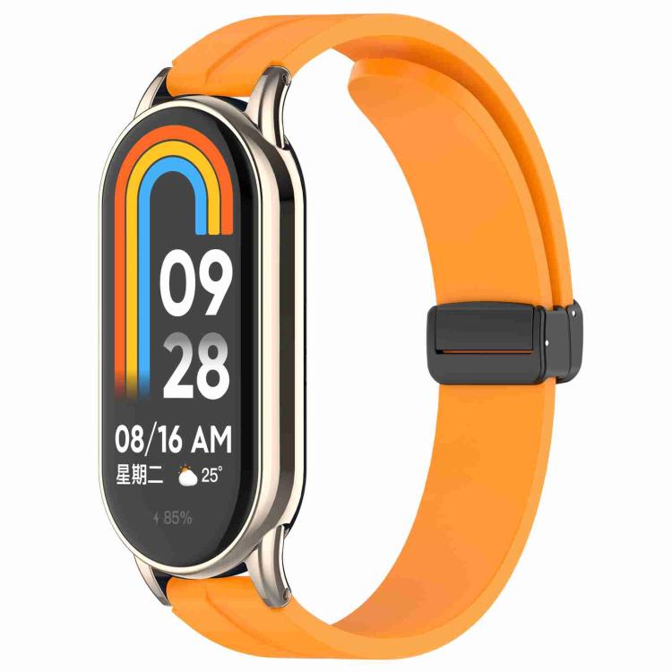 xDfind silicone watch band in bright orange with folding buckle, shown attached to a smartwatch