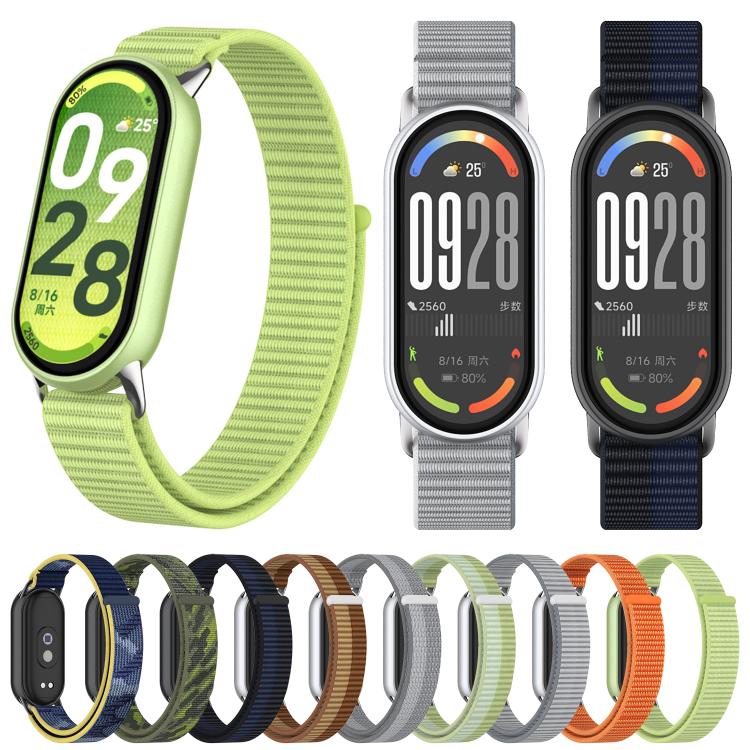 Nylon loop watch bands in several colors shown fitted to fitness trackers