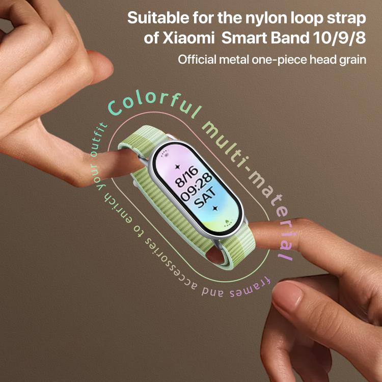 Light green nylon loop watch band fitted to a fitness tracker, held between fingers
