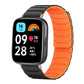Magnetic silicone watch band in black with a bright orange inner surface