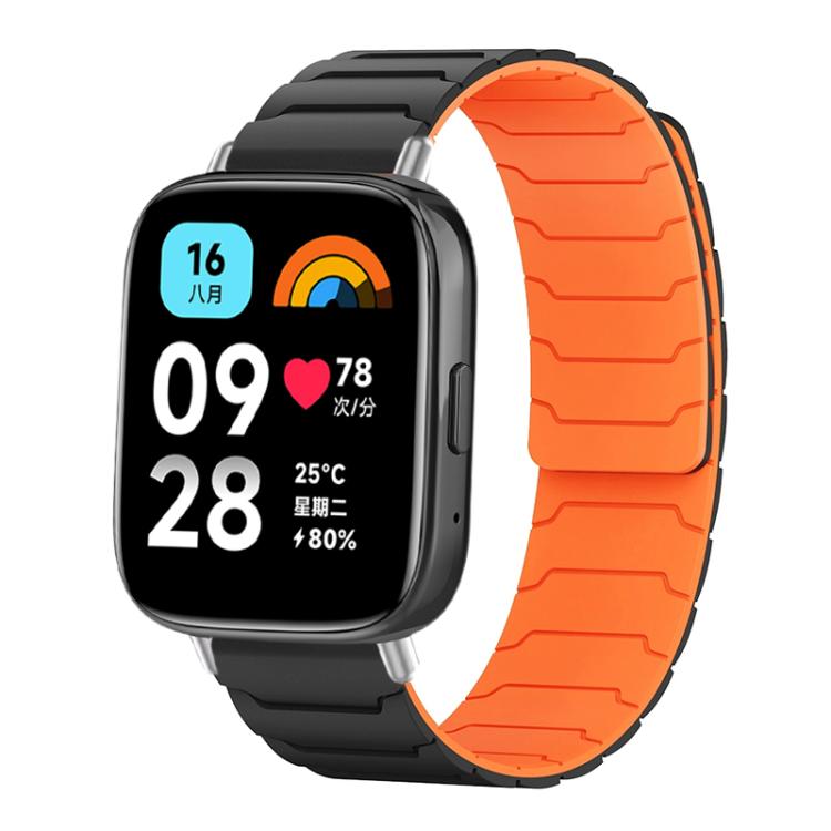 Magnetic silicone watch band in black with a bright orange inner surface