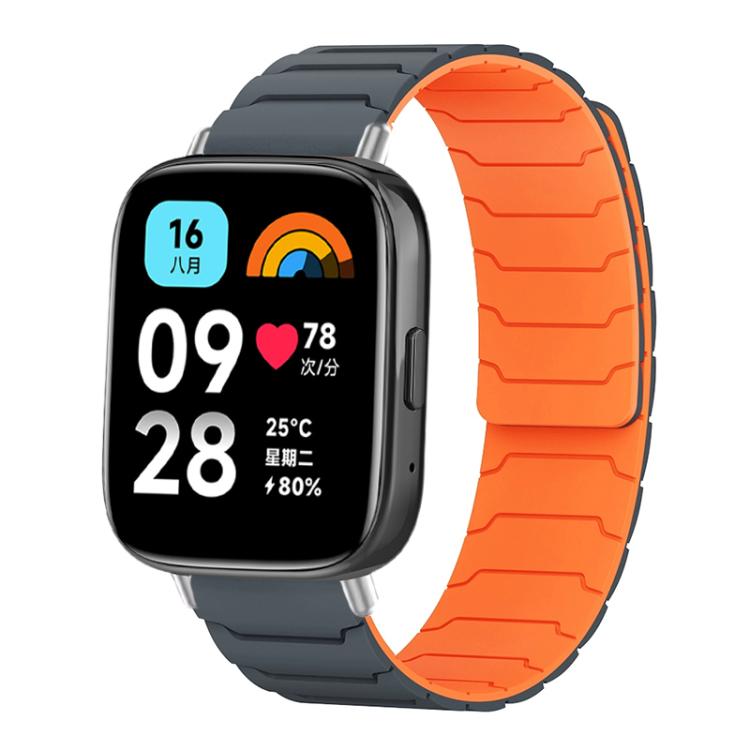 Magnetic silicone watch band in dark gray with a bright orange inner surface