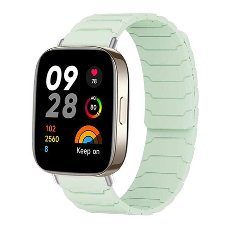 Mint green magnetic silicone watch band with segmented links, shown on a smartwatch