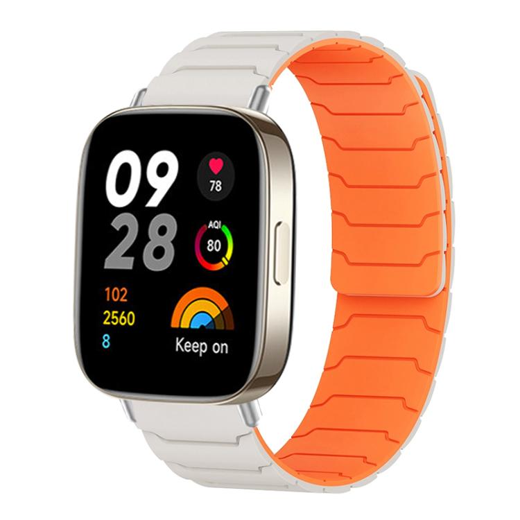 Light gray and orange magnetic silicone watch band fitted to a rectangular smartwatch