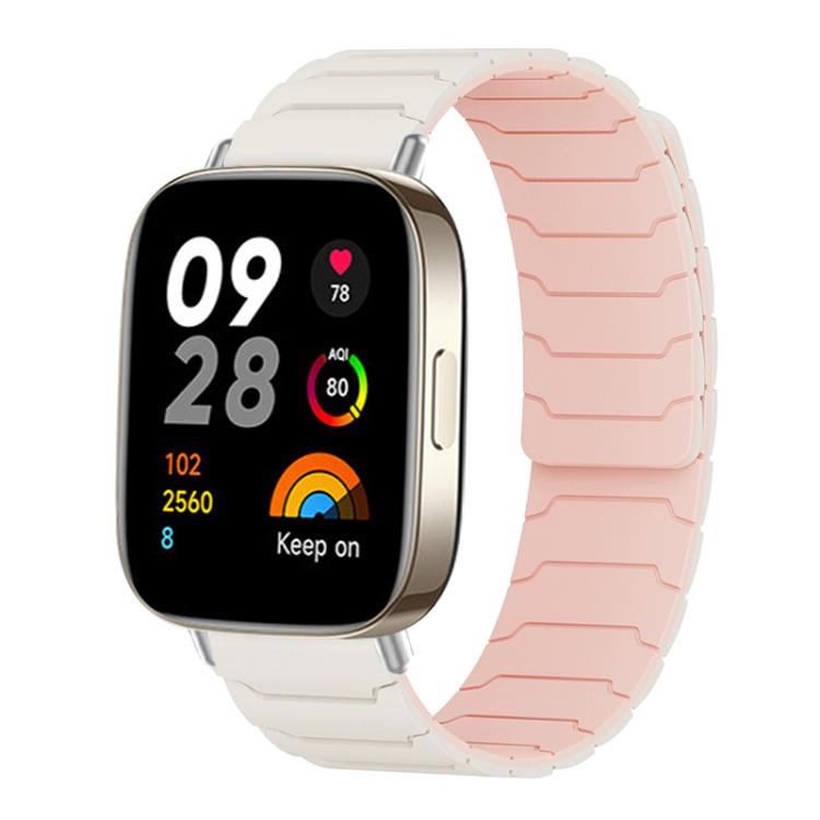 Light gray and pale pink magnetic silicone watch band fitted to a rectangular smartwatch