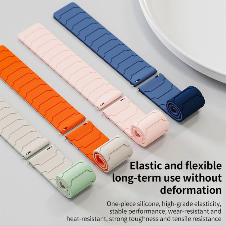Magnetic silicone watch bands in blue, pink, orange, and pale green, shown as two-piece straps